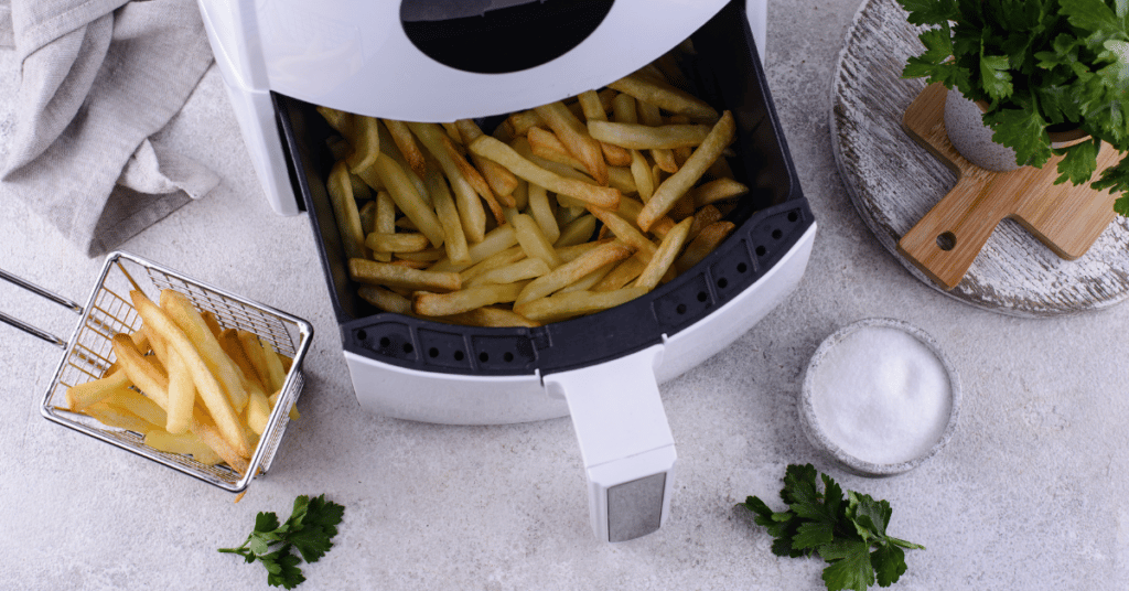 Air fryer with french fries and garnishment
