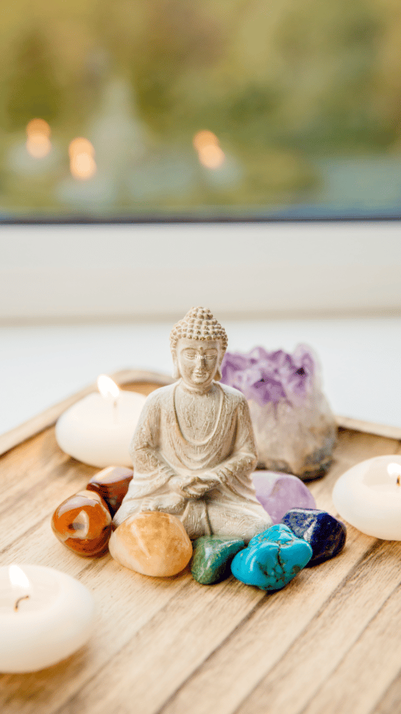 Buddha with crystal stones chakra colors