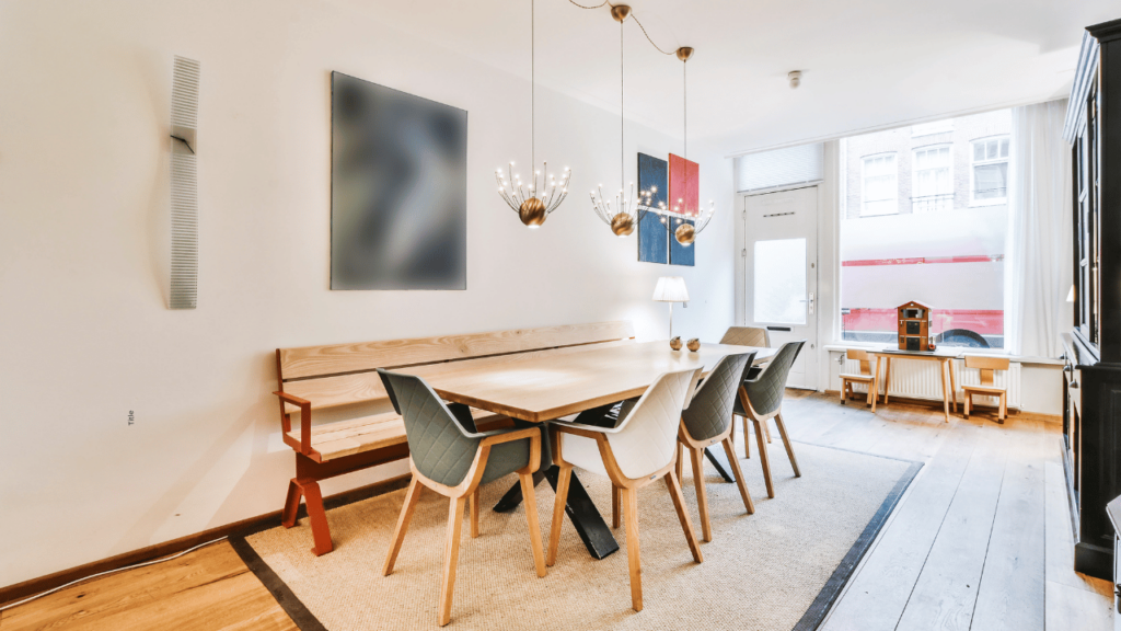 dining room table with art work on wall